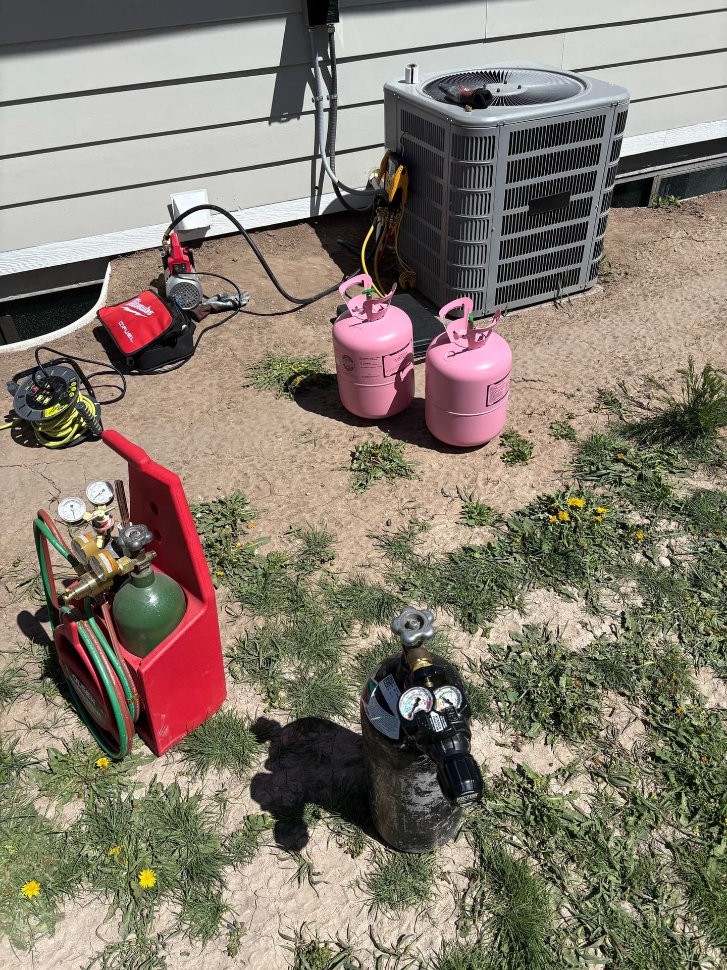 Recovery and recharge equipment set up for an AC repair