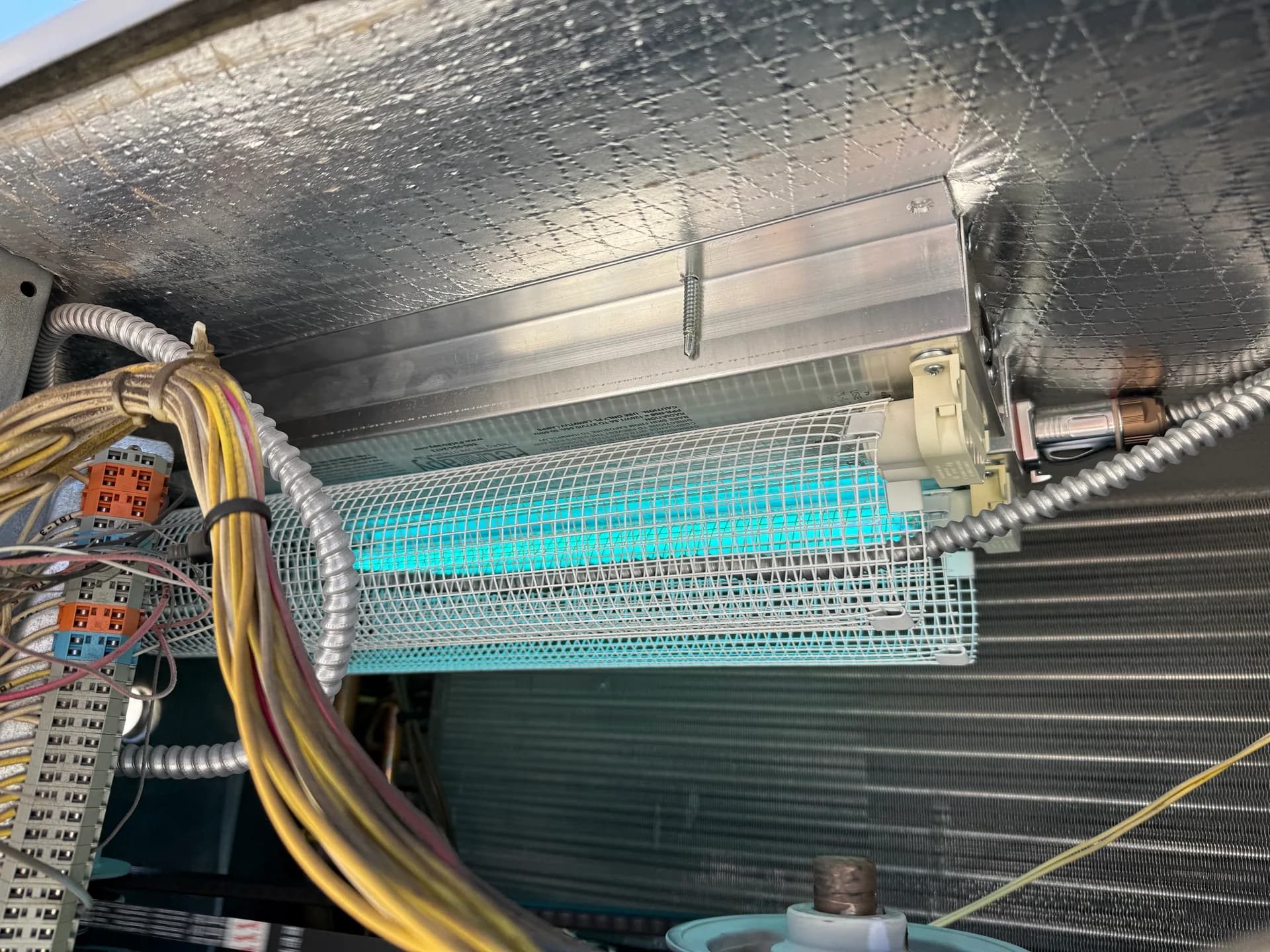A UV air scrubber installed inside a customer's ductwork