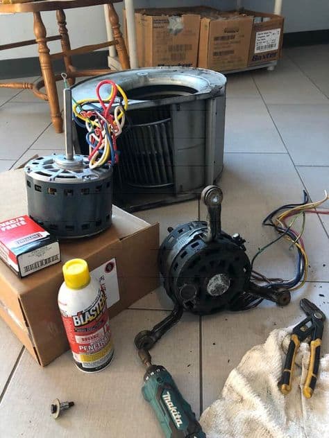 Air conditioner components laid out for repair and system inspection
