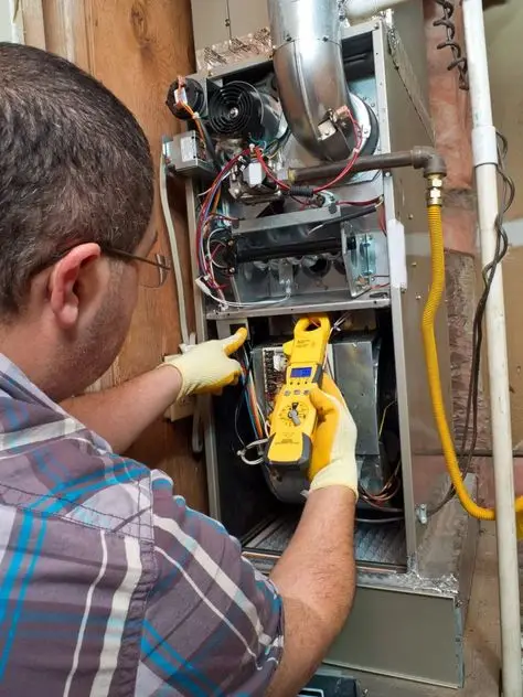 Certified technician tuning a gas furnace system for winter readiness