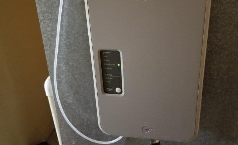 Close-up of a whole-home humidifier unit installed on an HVAC duct in a West Jordan, Utah home to improve indoor air quality during dry fall months.