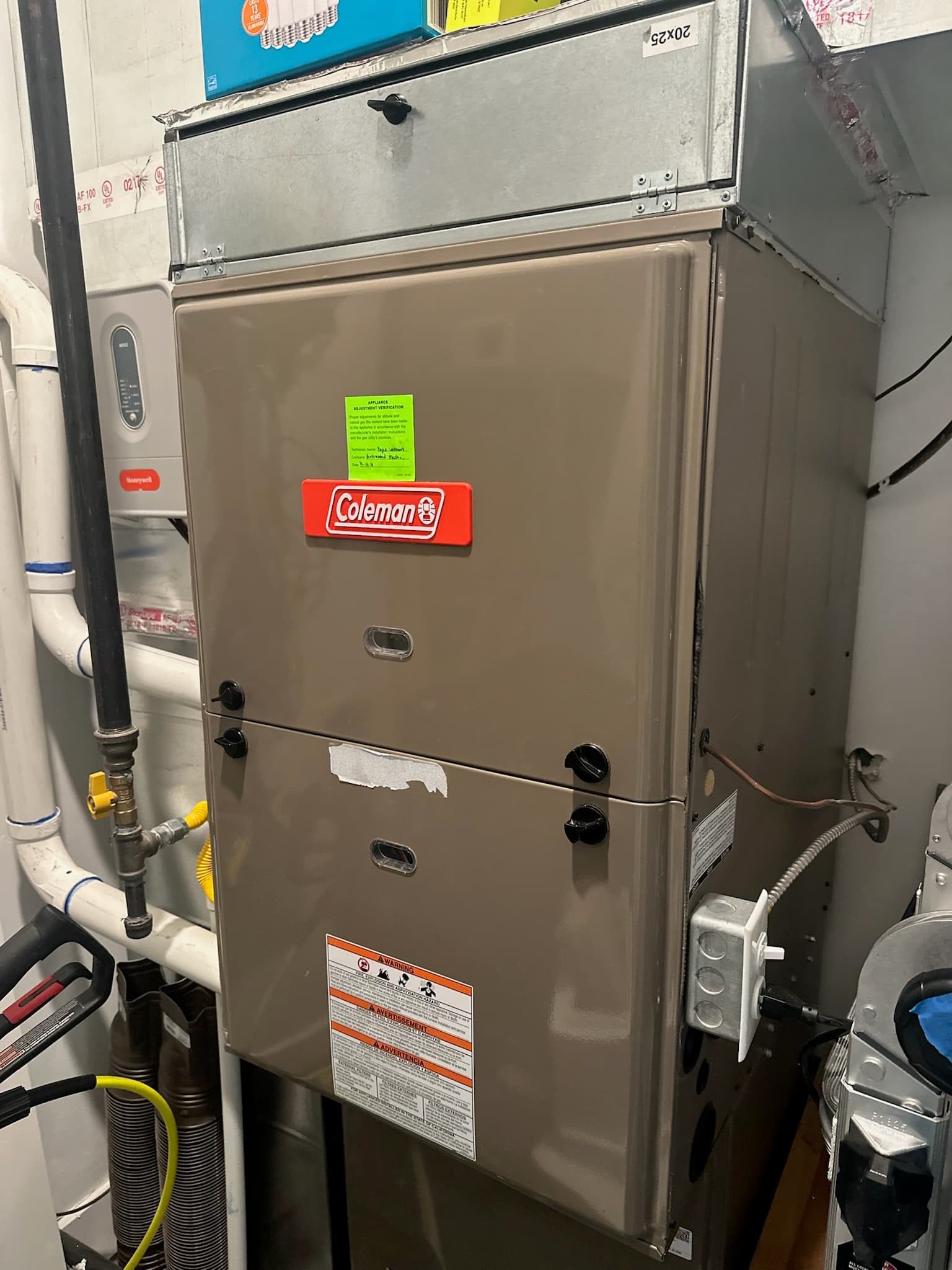 A Coleman furnace installed in a utility room, highlighting the importance of regular HVAC maintenance and filter care to extend system lifespan and improve efficiency.